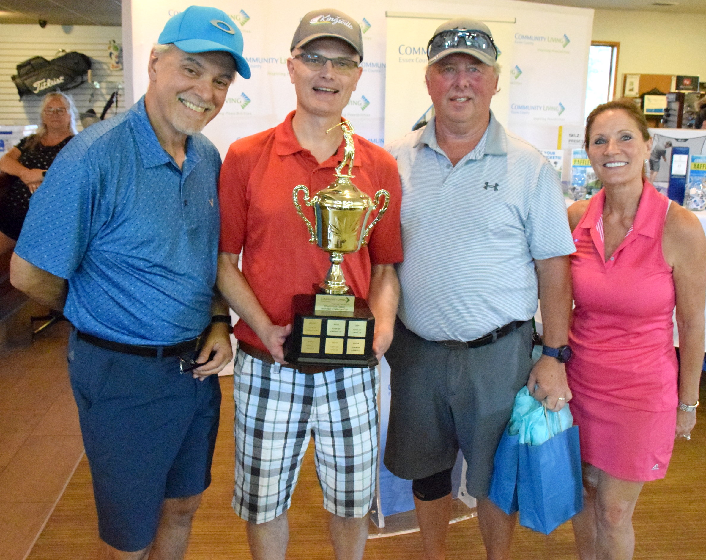 Tony DeSantis and Karen Bolger of Community Living Essex County present the municipal cup challenge winners with the trophy.
