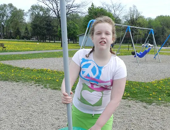 Respite girl playing in playground