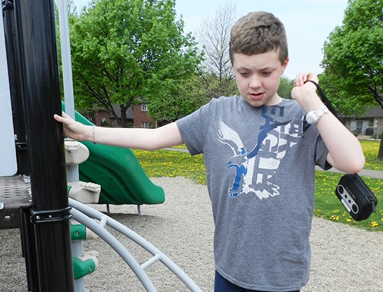 Respite boy playing in playground